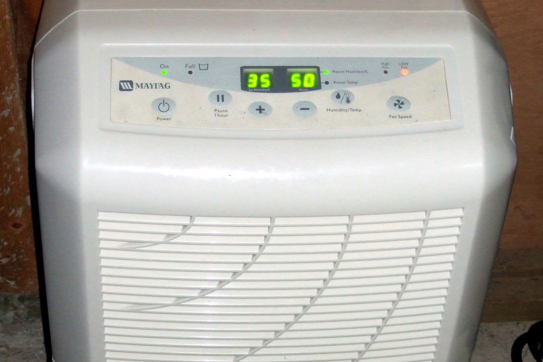 Portable dehumidifier in a basement setting