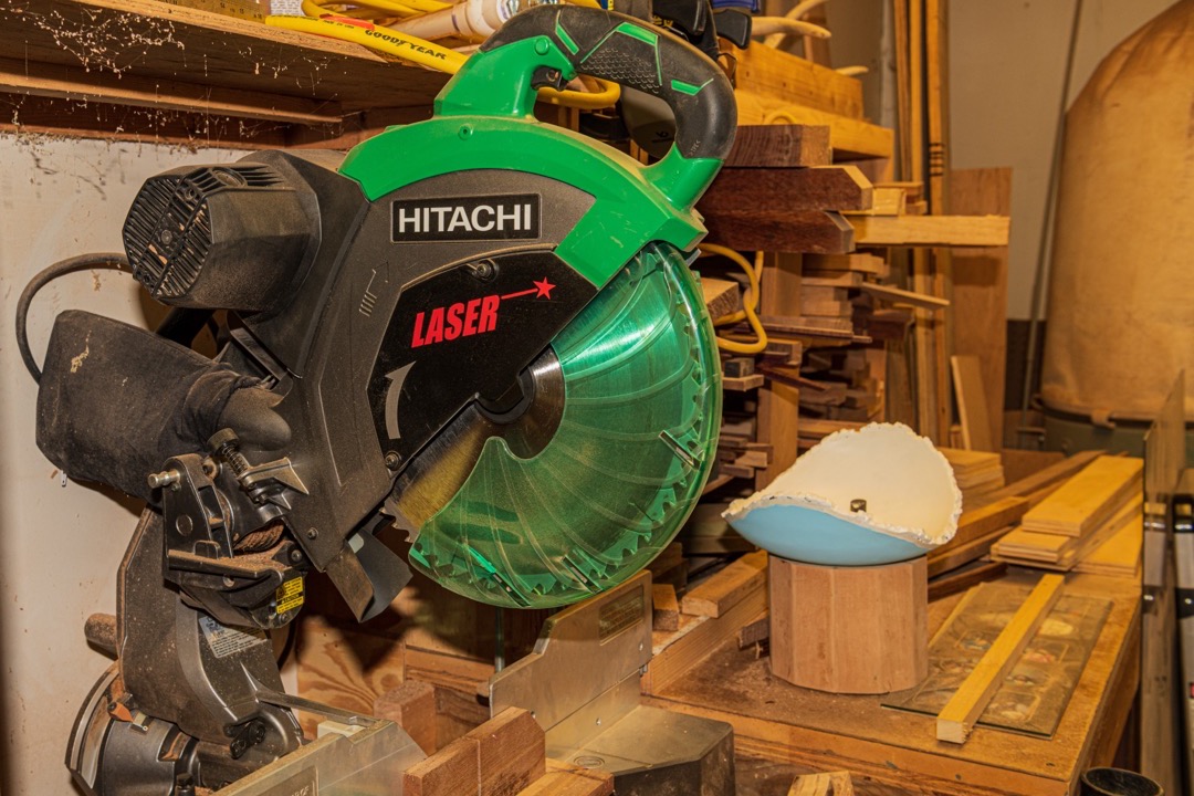 DEWALT sliding compound miter saw on a workshop bench
