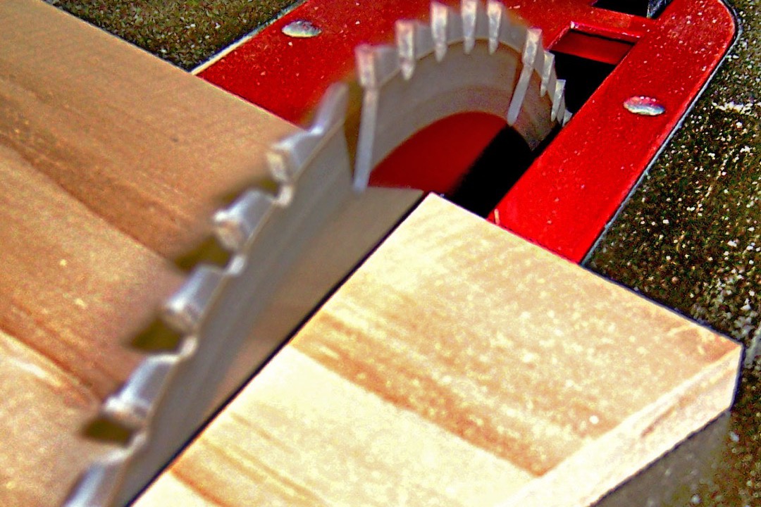 Table saw cutting wood at an angle on a jobsite