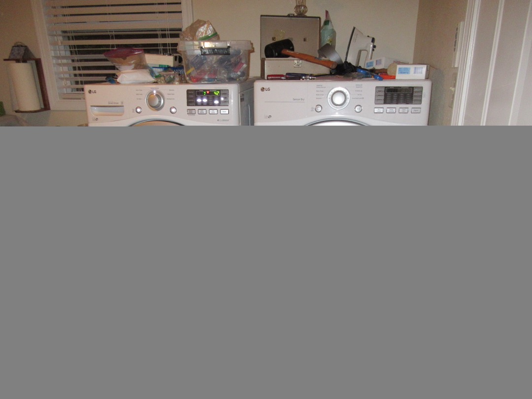 Stacked washer and dryer laundry center in a modern utility room
