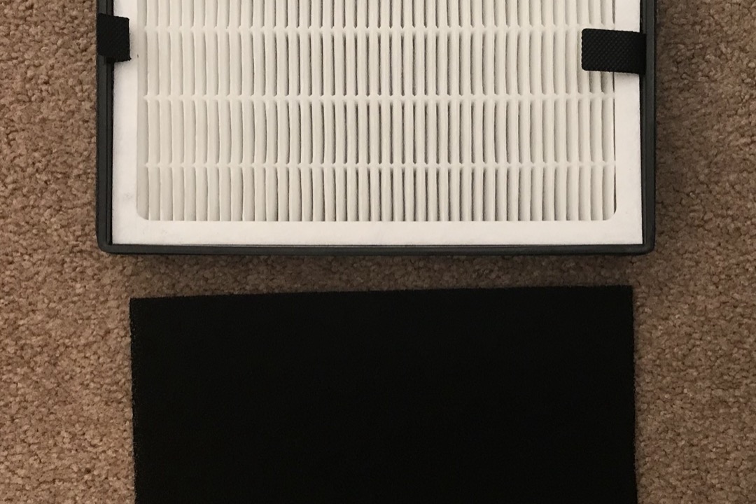 HEPA air purifier with replaceable filter cartridge in a home living room
